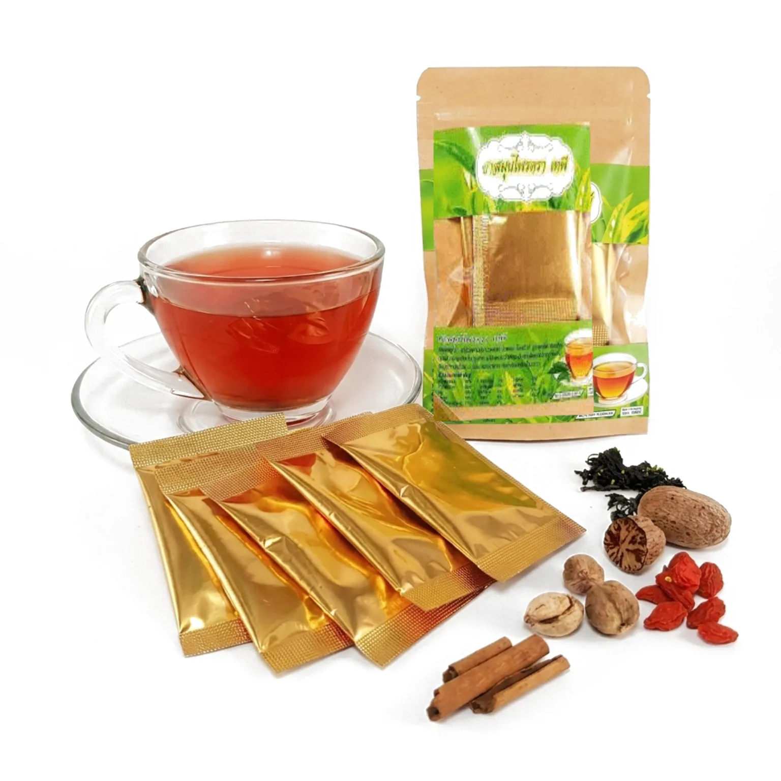 Gold-foil single-cup Tapee Tea teabags with dried Thai botanicals