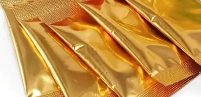 Close view of the gold-foil sachets, each holding one cup of the ground blend
