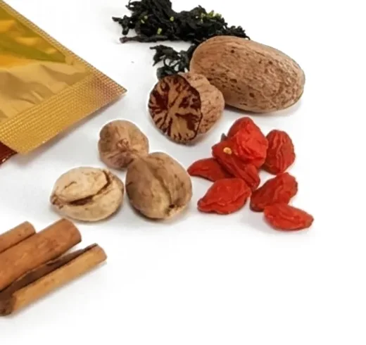 Whole nutmeg, dried goji berries, cinnamon bark and dried herbs
